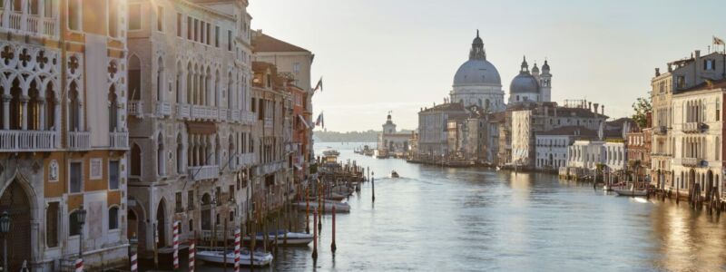 Grand Canal in Venice with Saint Mary of Health basilica, sun in Italy
